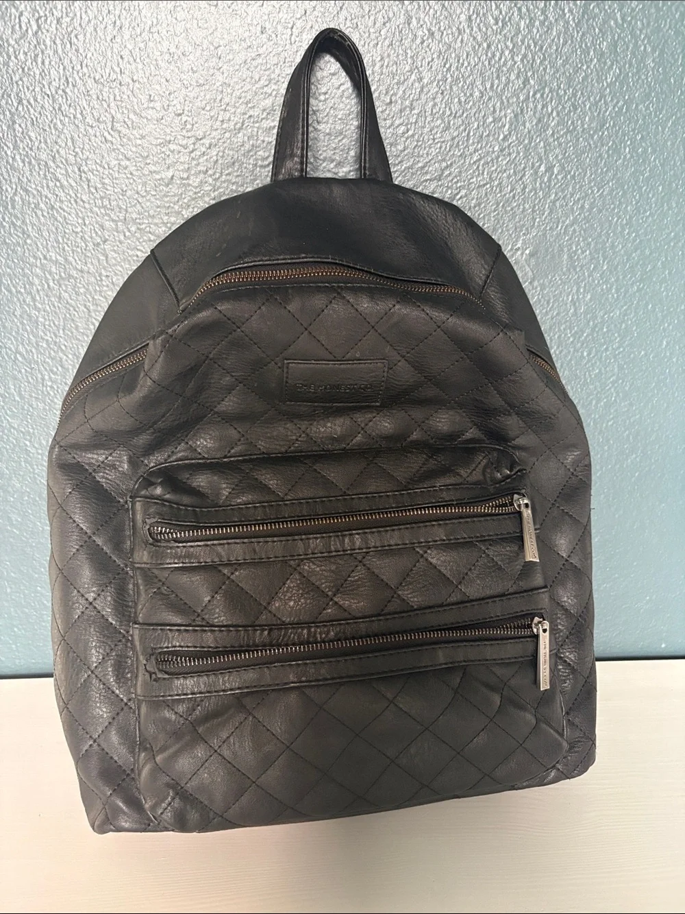 The Honest Company Diamond Quilted Black Faux Leather Backpack